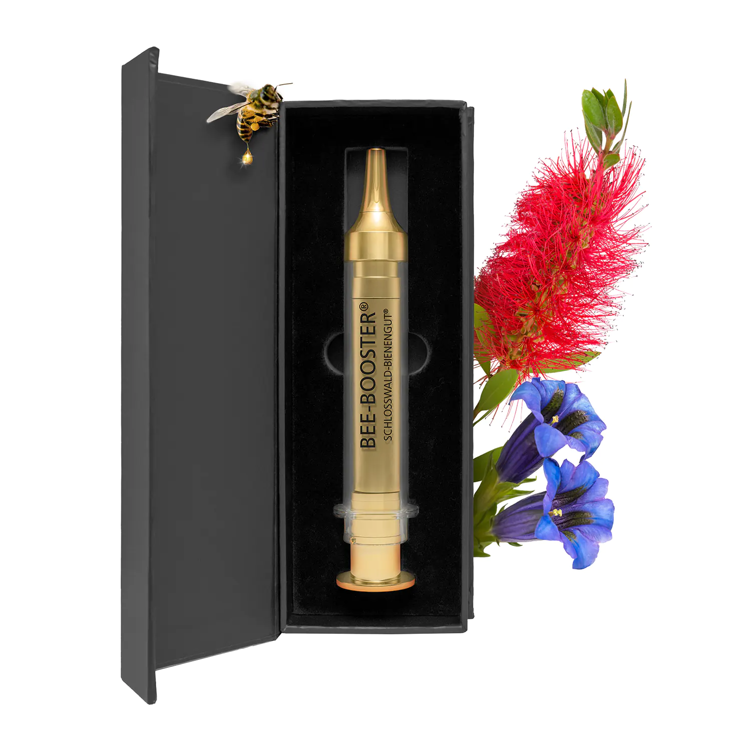 Goldene Bee-Booster Ampulle von Schlosswald-Bienengut in geöffneter schwarzer Geschenkbox, mit Biene und Blütenmotiv
